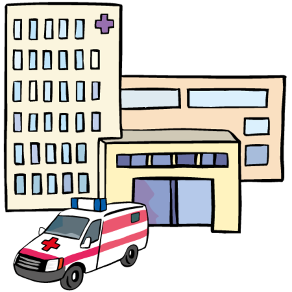 Ein Krankenhausgebäude, vor dem ein Krankenwagen steht. 