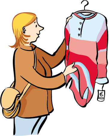 Eine Frau schaut sich Kleidung in einem Geschäft an. 